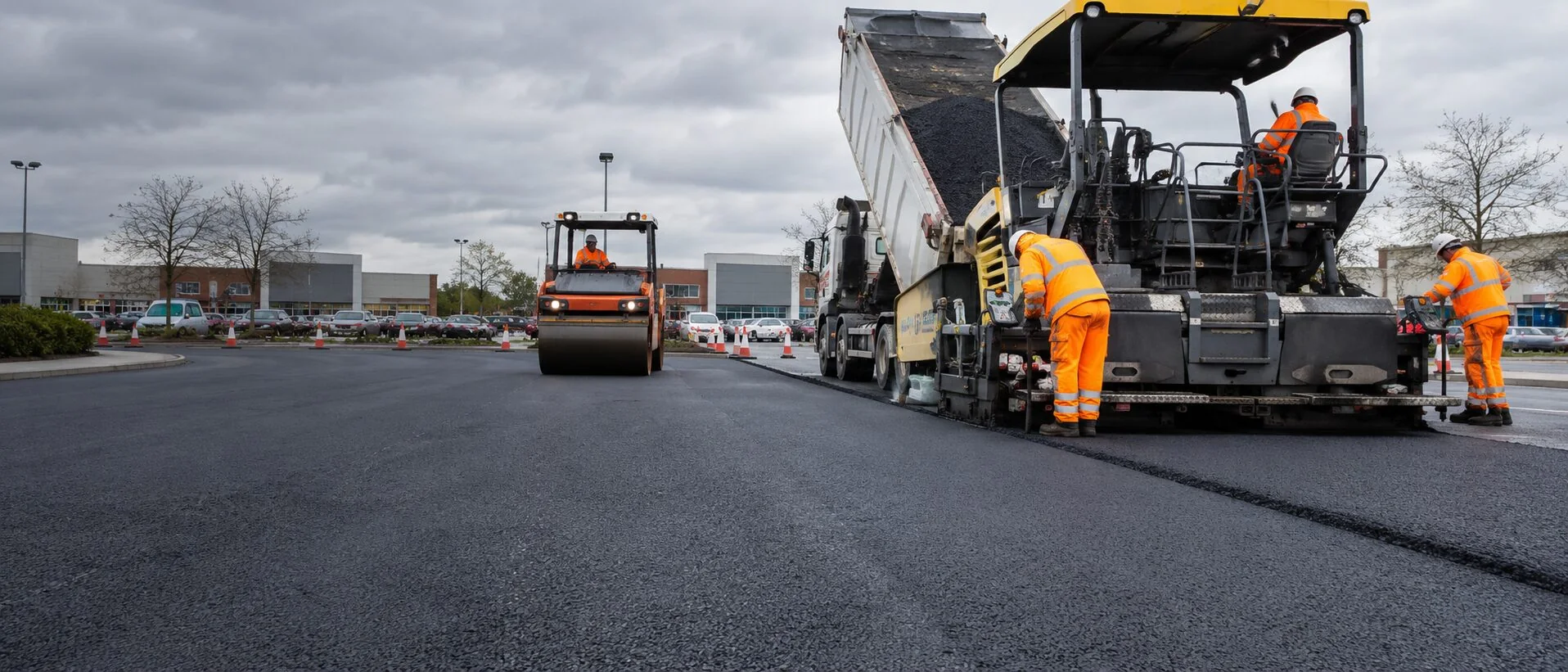 Commercial tarmac resurfacing underway at a UK retail park